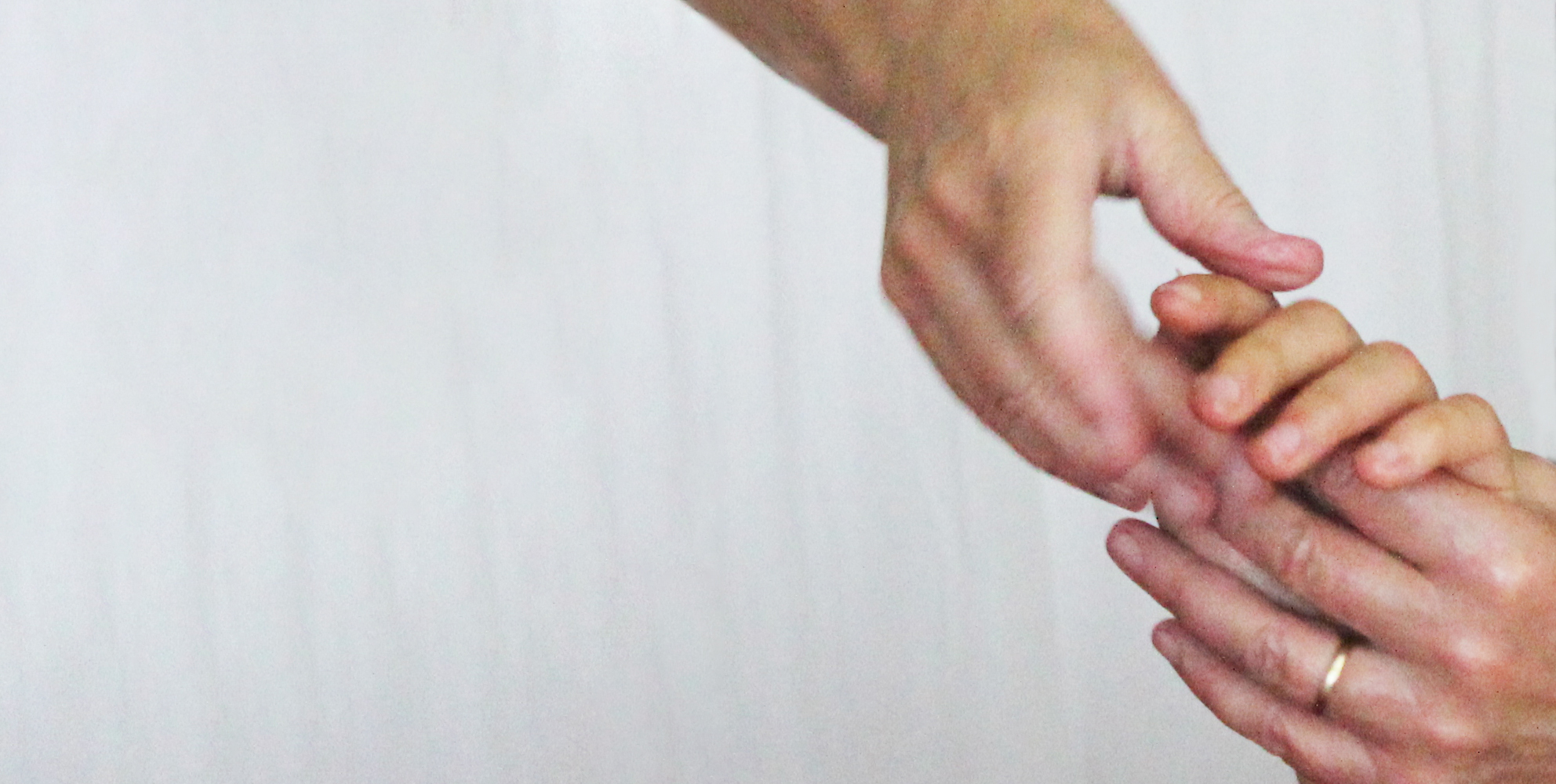 A close up of Deborah Aguirre Jones performing a hand massage