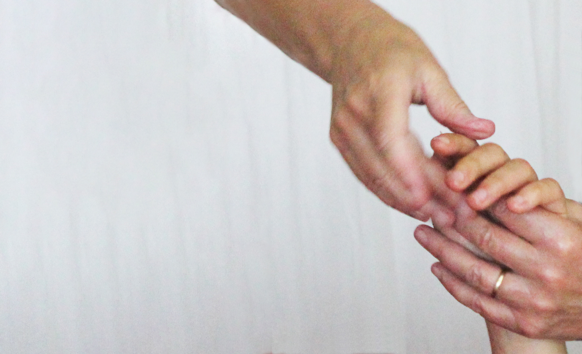 A close up of Deborah Aguirre Jones performing a hand massage